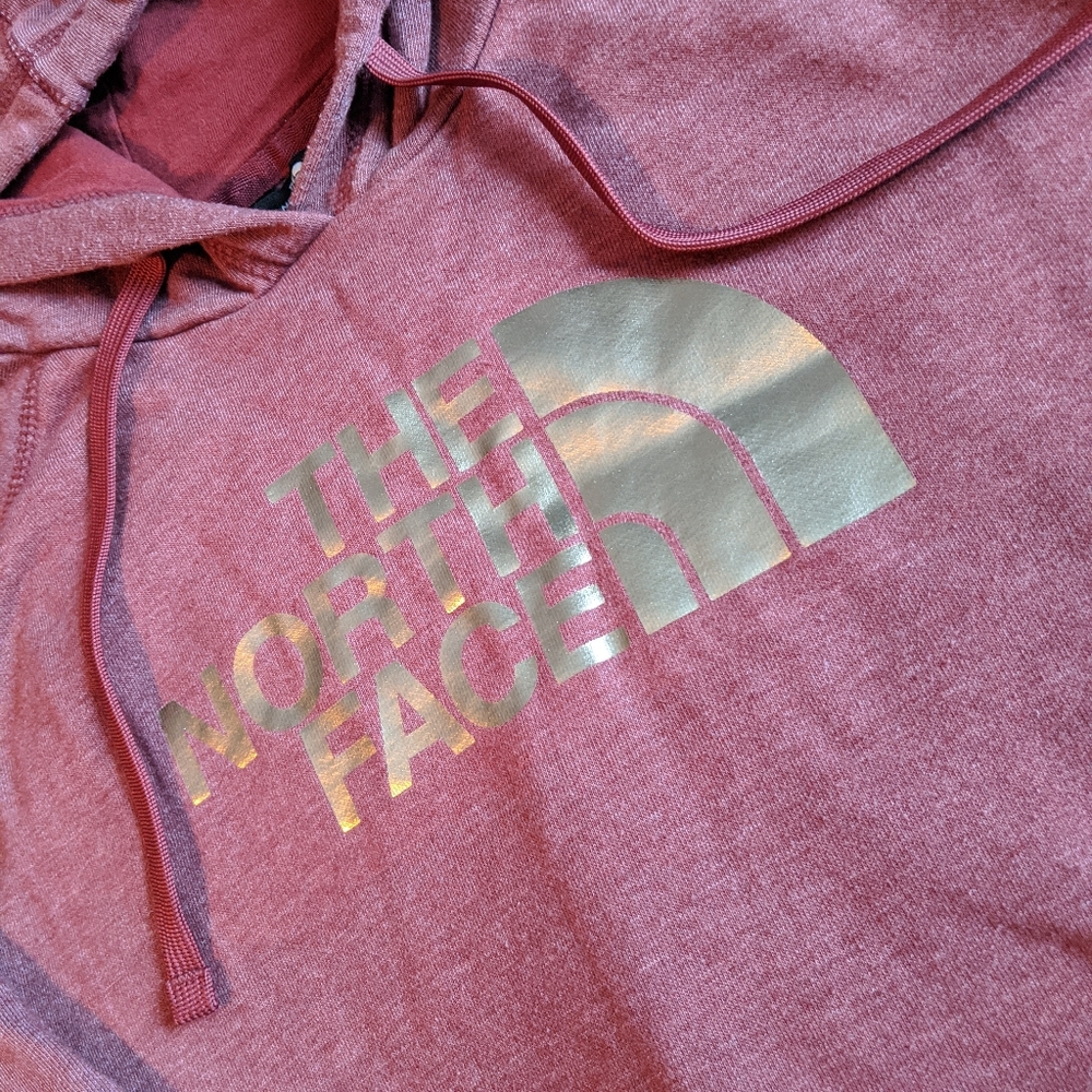The North Face maroon and gold hoodie